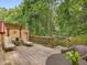 Private outdoor space on back deck, shaded by a canopy of trees, is perfect for relaxation at 3347 Ridgecrest Ct, Raleigh, NC 27607