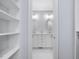 View of a bright, elegant bathroom from a walk-in closet at 3347 Ridgecrest Ct, Raleigh, NC 27607