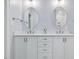 Elegant bathroom featuring double sinks, marble countertop and dual mirrors at 3347 Ridgecrest Ct, Raleigh, NC 27607