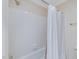 Clean bathroom features a shower-tub combination with white tiles and a shower curtain at 3347 Ridgecrest Ct, Raleigh, NC 27607