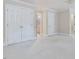 Spacious bedroom with neutral paint, white trim, white carpet, and access to ensuite bathroom at 3347 Ridgecrest Ct, Raleigh, NC 27607