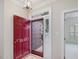 Inviting foyer with a partial view of the red front door with decorative glass at 3347 Ridgecrest Ct, Raleigh, NC 27607