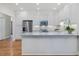 Bright kitchen with stainless steel refrigerator, microwave, and granite countertops at 3347 Ridgecrest Ct, Raleigh, NC 27607