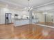 Open concept kitchen with stainless steel appliances, and hardwood floors at 3347 Ridgecrest Ct, Raleigh, NC 27607