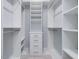 Walk-in closet featuring custom shelving, storage drawers and hanging racks at 3347 Ridgecrest Ct, Raleigh, NC 27607