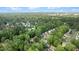 Aerial view of a neighborhood with mature trees and well-maintained lawns at 3541 E Jameson Rd, Raleigh, NC 27604