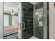 Updated bath includes tiled shower and an open view to an adjacent green bedroom at 3541 E Jameson Rd, Raleigh, NC 27604