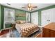 Cozy bedroom featuring a ceiling fan, matching bedside tables, and beautiful decor at 3541 E Jameson Rd, Raleigh, NC 27604