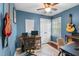 Blue bedroom with guitars, desk and chair, a double door closet and nice white trim at 3541 E Jameson Rd, Raleigh, NC 27604