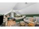 Attic bedroom featuring angled walls, comfortable seating, and a cozy bed at 3541 E Jameson Rd, Raleigh, NC 27604