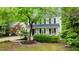 Charming two-story home with a inviting front porch and mature landscaping, offering a warm and welcoming curb appeal at 3541 E Jameson Rd, Raleigh, NC 27604