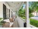 Inviting front porch with charming decor, comfortable seating, creating a relaxing outdoor space at 3541 E Jameson Rd, Raleigh, NC 27604