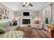 Cozy living room features a fireplace, plush seating, and stylish decor for a comfortable and inviting atmosphere at 3541 E Jameson Rd, Raleigh, NC 27604
