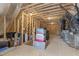 Unfinished attic with exposed rafters provides ample storage space with storage bins at 4001 Bostwyck Dr, Fuquay Varina, NC 27526