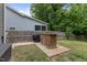 Backyard patio area with a built-in grill and ample space for outdoor entertaining at 4001 Bostwyck Dr, Fuquay Varina, NC 27526