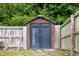 Backyard storage shed featuring a wood frame, painted siding, and durable doors at 4001 Bostwyck Dr, Fuquay Varina, NC 27526