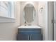 Bathroom featuring modern vanity with beautiful light fixture at 4001 Bostwyck Dr, Fuquay Varina, NC 27526