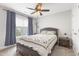 Bedroom with a bed, ceiling fan, and window overlooking the outdoors at 4001 Bostwyck Dr, Fuquay Varina, NC 27526