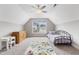 Bright bedroom featuring a large window, neutral colors, and carpeted floors at 4001 Bostwyck Dr, Fuquay Varina, NC 27526