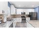 Well-appointed kitchen with stainless steel appliances, granite countertops, and ample cabinet space at 4001 Bostwyck Dr, Fuquay Varina, NC 27526