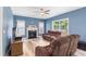 Inviting living room with fireplace, light floors, and ample natural light at 4001 Bostwyck Dr, Fuquay Varina, NC 27526