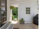 Entrance to back porch with small steps, potted plants and view to the backyard at 4112 Rowan St, Raleigh, NC 27609