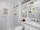 Modern bathroom features subway tile shower and marble vanity at 4112 Rowan St, Raleigh, NC 27609