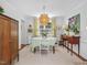 Elegant dining room with stylish lighting, neutral carpet, and ample space for entertaining at 4112 Rowan St, Raleigh, NC 27609