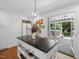 Well-lit kitchen with island and easy access to the screened-in porch at 4112 Rowan St, Raleigh, NC 27609