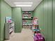 Organized playroom featuring shelves and storage baskets filled with toys and games at 4112 Rowan St, Raleigh, NC 27609