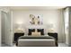 Inviting bedroom with a plush bed, stylish nightstands, and ample natural light at 4308 Hunters Brook Run, Raleigh, NC 27616
