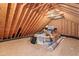 Spacious unfinished attic area showing plywood flooring with dormer window at 4412 Thistlehill Ct, Raleigh, NC 27616