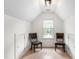 Finished attic space featuring hardwood floors, chair rail trim, and lots of natural light at 4412 Thistlehill Ct, Raleigh, NC 27616