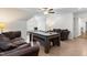 Large game room with a pool table and comfortable seating, perfect for entertainment at 4412 Thistlehill Ct, Raleigh, NC 27616
