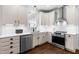 Bright kitchen featuring stainless steel appliances, subway tile backsplash and hardwood flooring at 4412 Thistlehill Ct, Raleigh, NC 27616