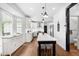 Bright kitchen featuring an island with seating, stainless steel appliances and hardwood flooring at 4412 Thistlehill Ct, Raleigh, NC 27616