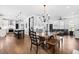 Spacious living area with an open floor plan, connecting dining, living, and kitchen at 4412 Thistlehill Ct, Raleigh, NC 27616