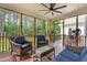 Relaxing screened porch with comfortable seating and views of the private backyard at 4412 Thistlehill Ct, Raleigh, NC 27616