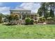 Lush backyard with a covered patio and an outdoor seating area, perfect for relaxing and entertaining at 5112 Highbury Grove Ln, Fuquay Varina, NC 27526
