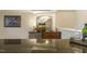 Close up shot of wet bar featuring granite countertops, decor and stainless steel refrigerator at 5112 Highbury Grove Ln, Fuquay Varina, NC 27526