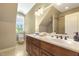 Bright bathroom with double sinks, marble countertops, and natural light at 5112 Highbury Grove Ln, Fuquay Varina, NC 27526