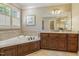 Bright bathroom features a soaking tub, vanity with granite counters, and tile accents at 5112 Highbury Grove Ln, Fuquay Varina, NC 27526
