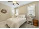 Cozy bedroom with natural light, a comfortable bed, and neutral decor at 5112 Highbury Grove Ln, Fuquay Varina, NC 27526