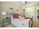 Comfortable bedroom featuring a ceiling fan, natural light, and closet space at 5112 Highbury Grove Ln, Fuquay Varina, NC 27526