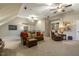 Inviting bonus room with leather seating, wet bar, and neutral carpeting, perfect for relaxing and entertaining at 5112 Highbury Grove Ln, Fuquay Varina, NC 27526
