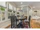 Charming dining room with natural light, dark wood table, and views into other living spaces at 5112 Highbury Grove Ln, Fuquay Varina, NC 27526