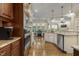 Open-concept kitchen with stainless steel appliances and granite countertops at 5112 Highbury Grove Ln, Fuquay Varina, NC 27526