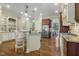 Open-concept kitchen includes granite countertops, stainless steel appliances, and ample cabinet space at 5112 Highbury Grove Ln, Fuquay Varina, NC 27526