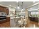 Spacious kitchen with an island, granite counters, stainless appliances, and open layout at 5112 Highbury Grove Ln, Fuquay Varina, NC 27526