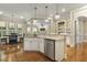Modern kitchen with granite countertops, stainless steel appliances, and open design at 5112 Highbury Grove Ln, Fuquay Varina, NC 27526